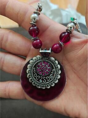 Silver Tone Braided Plastic Chain With Round Burgundy Pendant and Beaded Accents